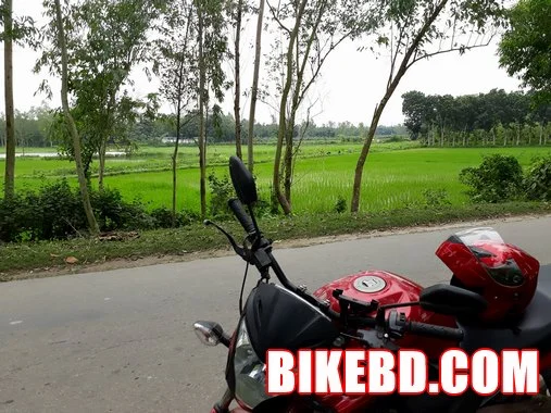 honda cb trigger 150 with red helmet